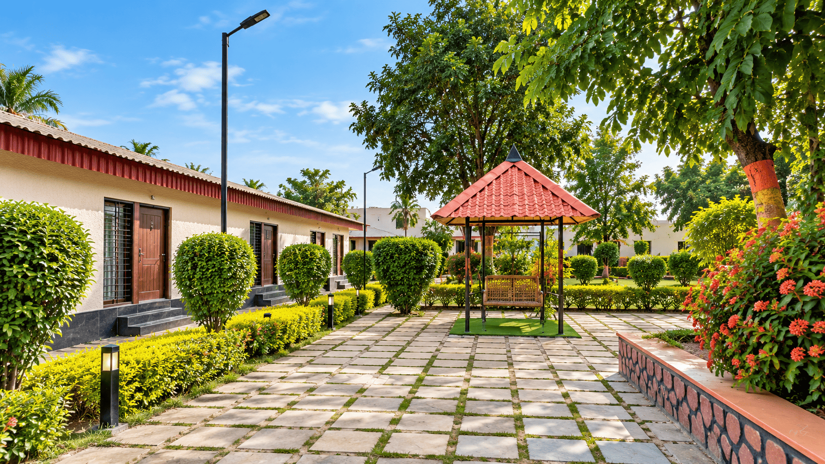 Garden walkway at Takshshila Park And Resorts